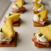 brown rice style triscuit cracker with pineapple, ham and cream cheese topper