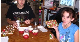 kids making gingerbread house