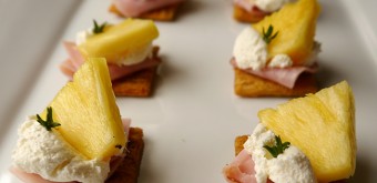brown rice style triscuit cracker with pineapple, ham and cream cheese topper