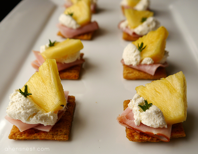 triscuit brown rice style cracker with pineapple, ham and cream cheese topper
